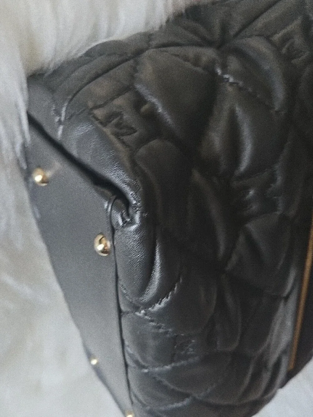 Quilted Black Tote with Gold Medallion Accent
